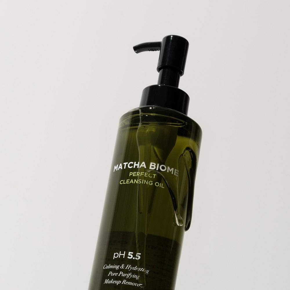 Heimish cleansing oil with a glass of matcha tea for skincare