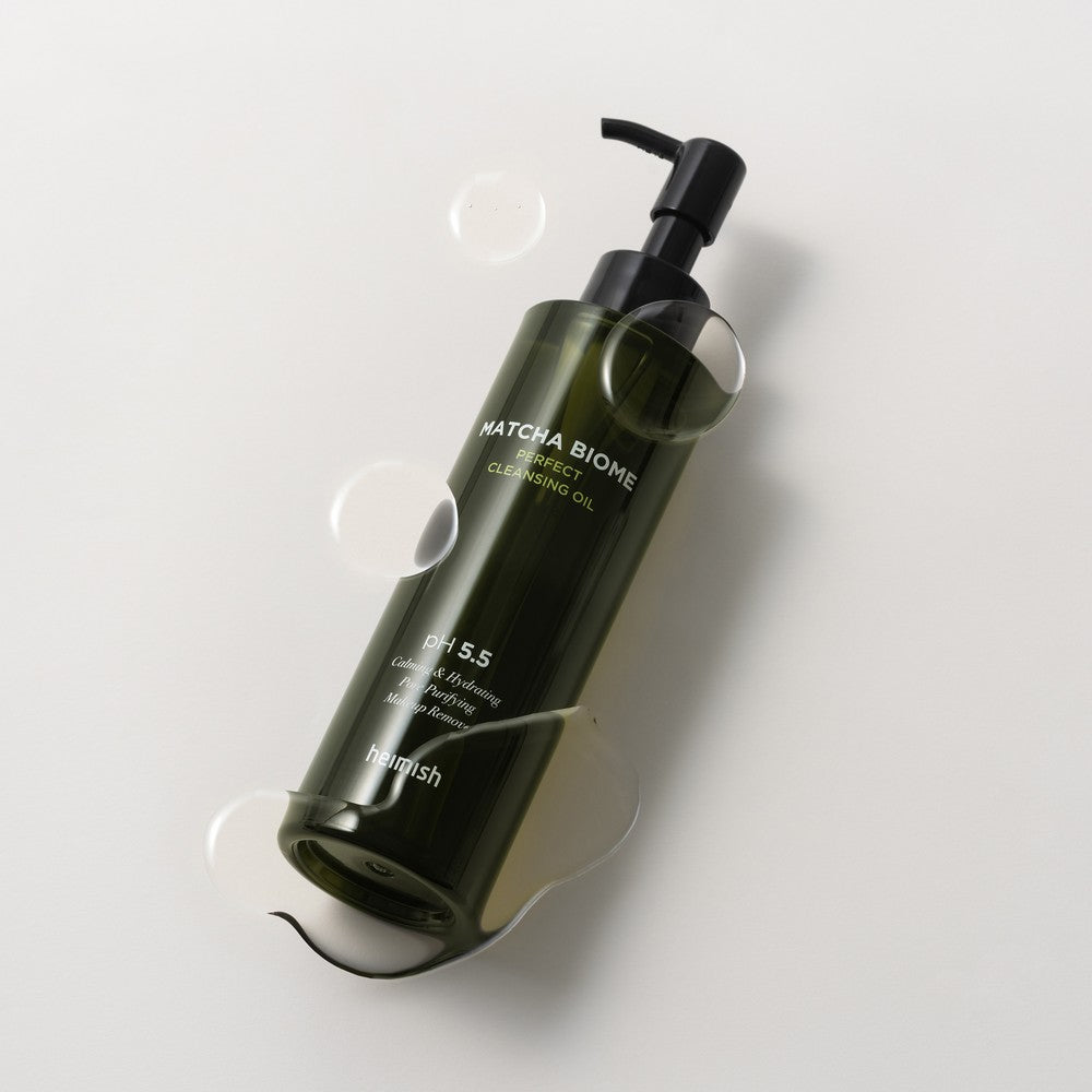Heimish Matcha cleansing oil on a wooden surface

